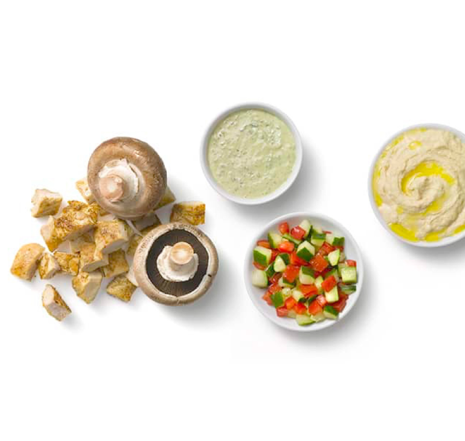 fresh ingredients of a mushroom, sliced cucumber, chicken and more